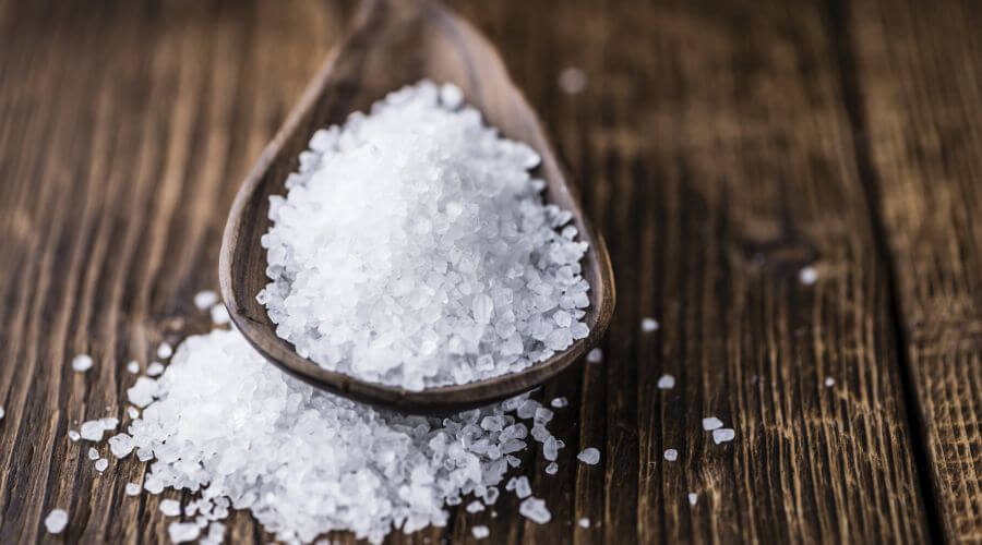 MSM crystals on  a wooden spoon